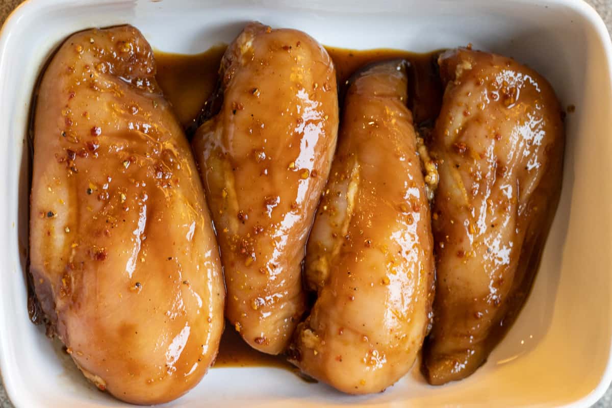 the chicken pieces are placed in an oven dish