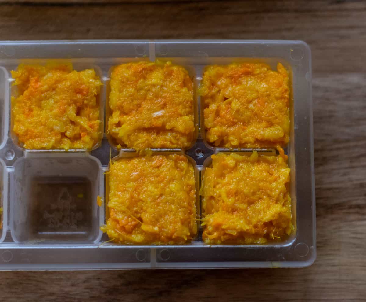 garlic ginger paste placed in ice cube trays for freezing