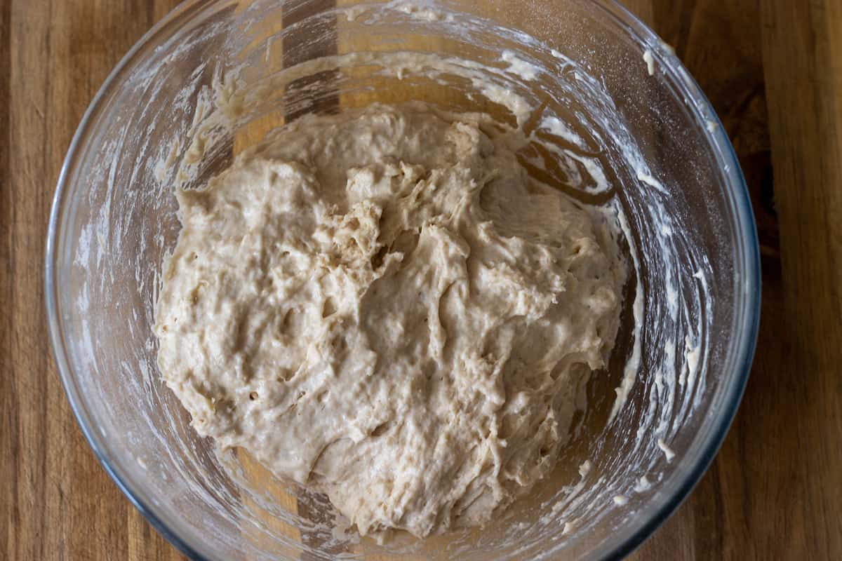 The remaining flour and salt are added to the bowl.