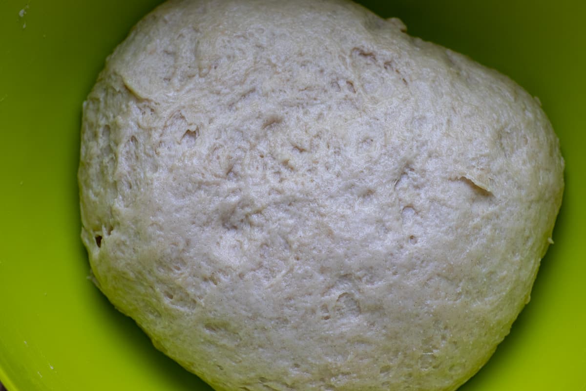 pogaca dough is made by adding the salt, flour and mahleb to wet ingredients