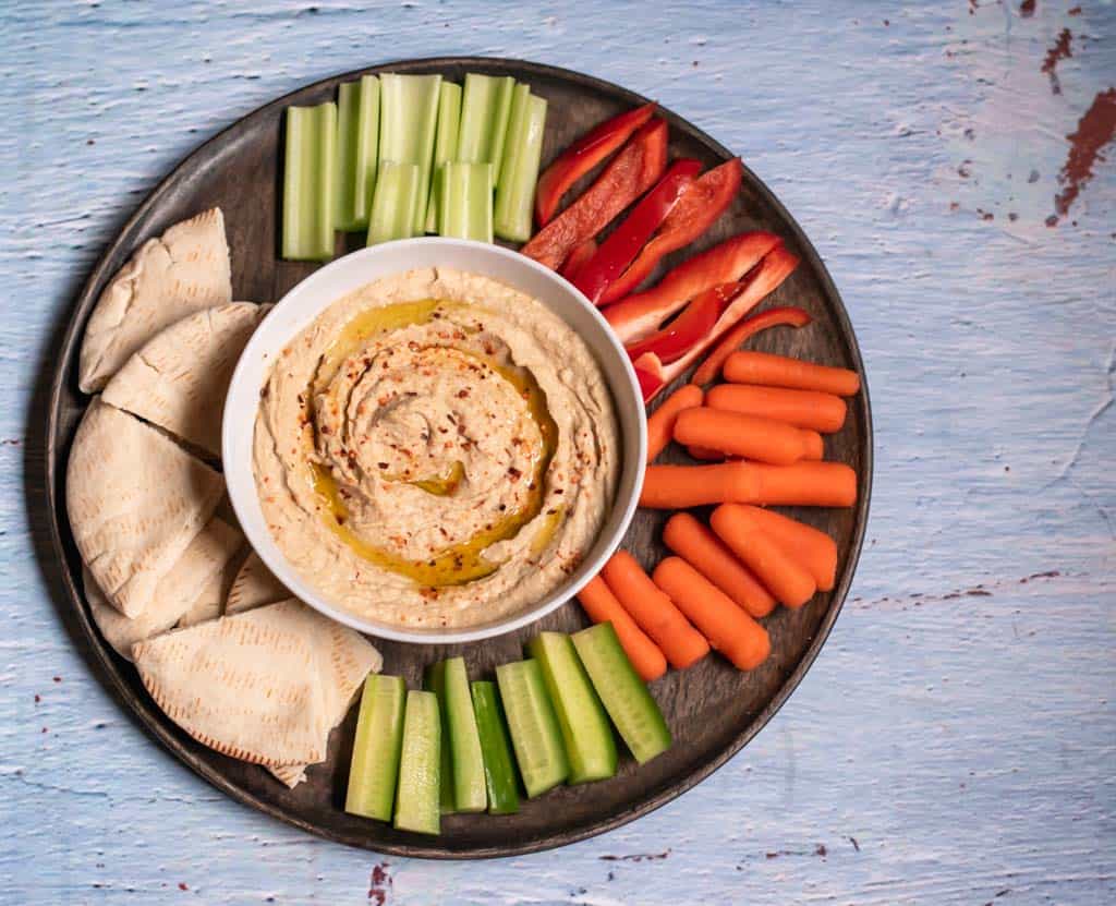 Mediterranean hummus dip served with pita bread and crudities