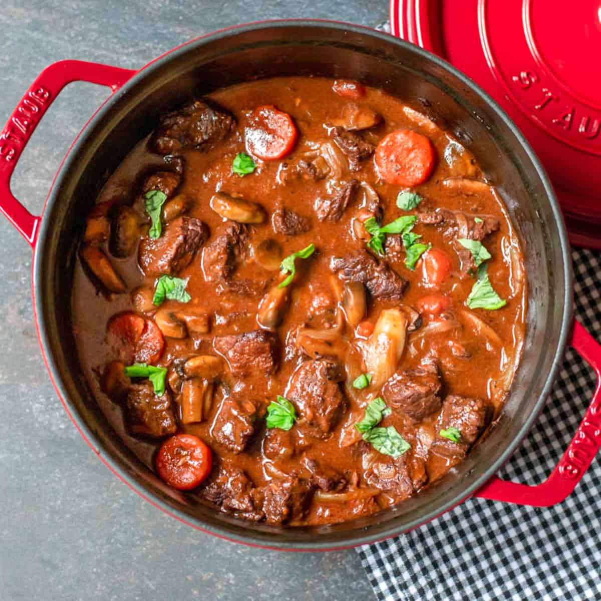 French slow cooked beef stew in a Dutch oven