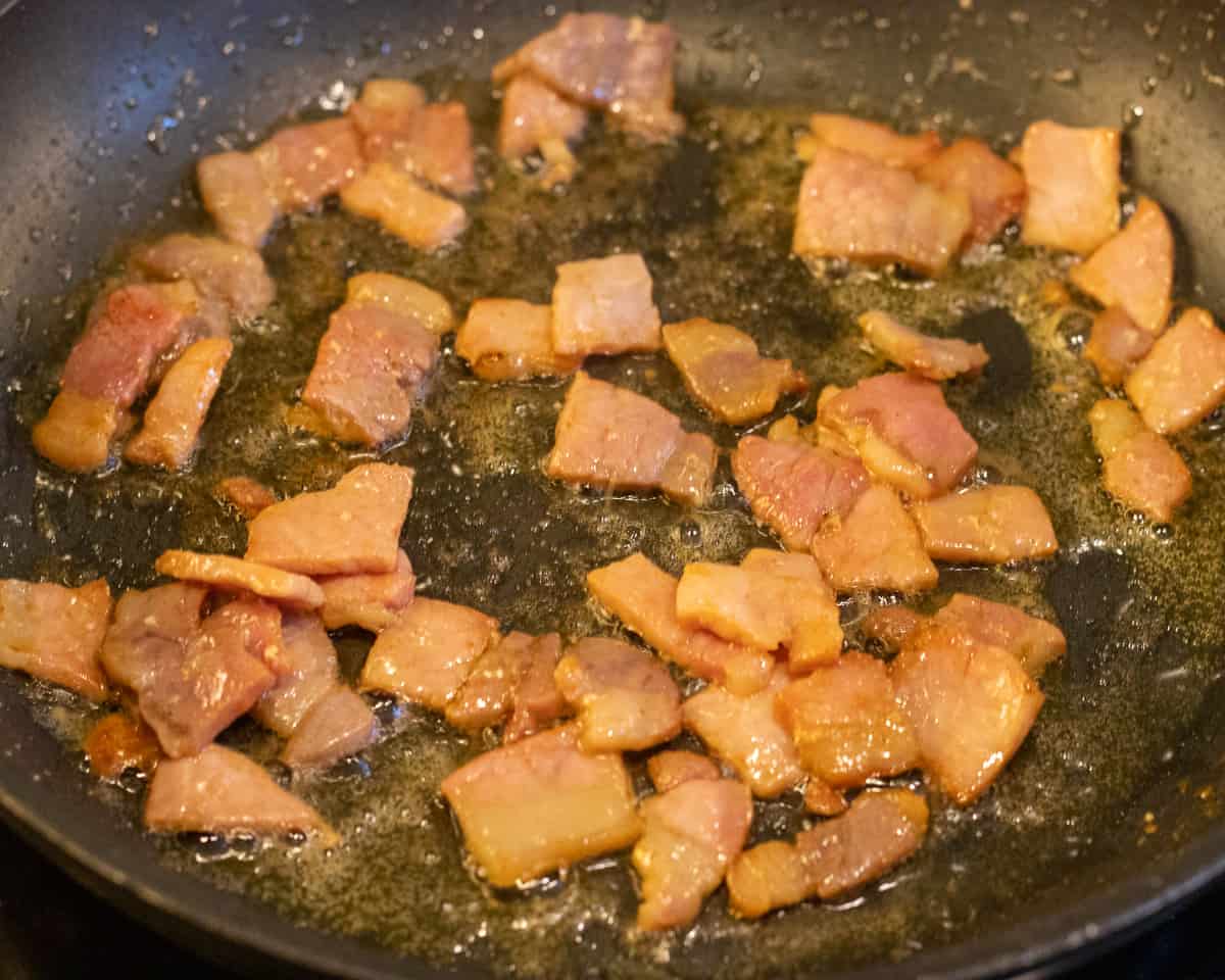 frying the bacon with butter