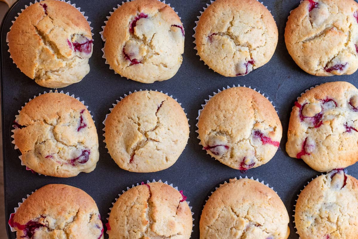 cranberry orange muffins are baked until golden brown
