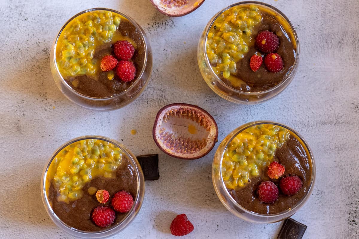 dark chocolate mousse is divided into 4 glasses