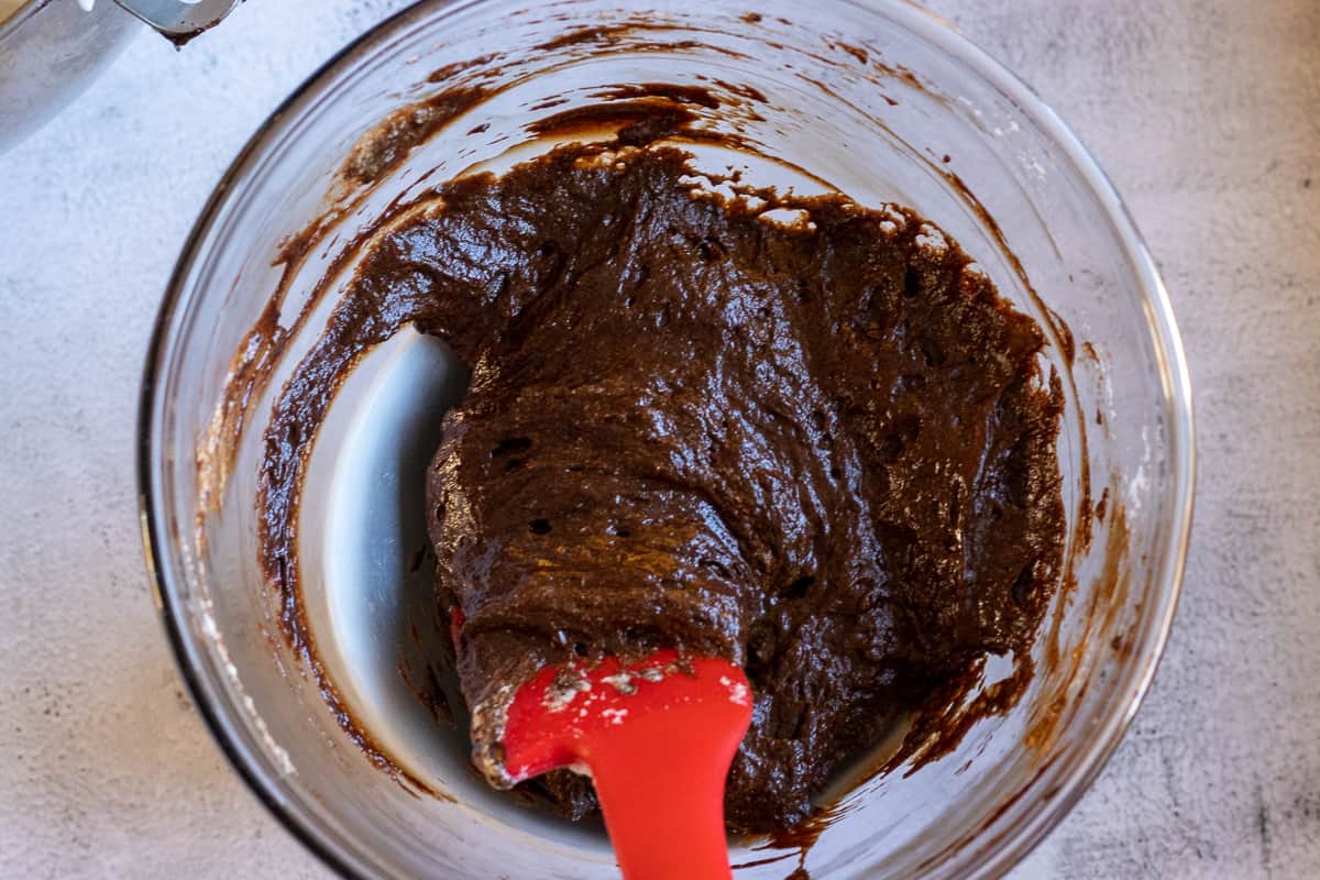 one third of the egg whites are folded to melted chocolate