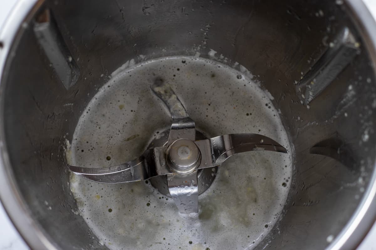 blitzing the garlic with lemon juice