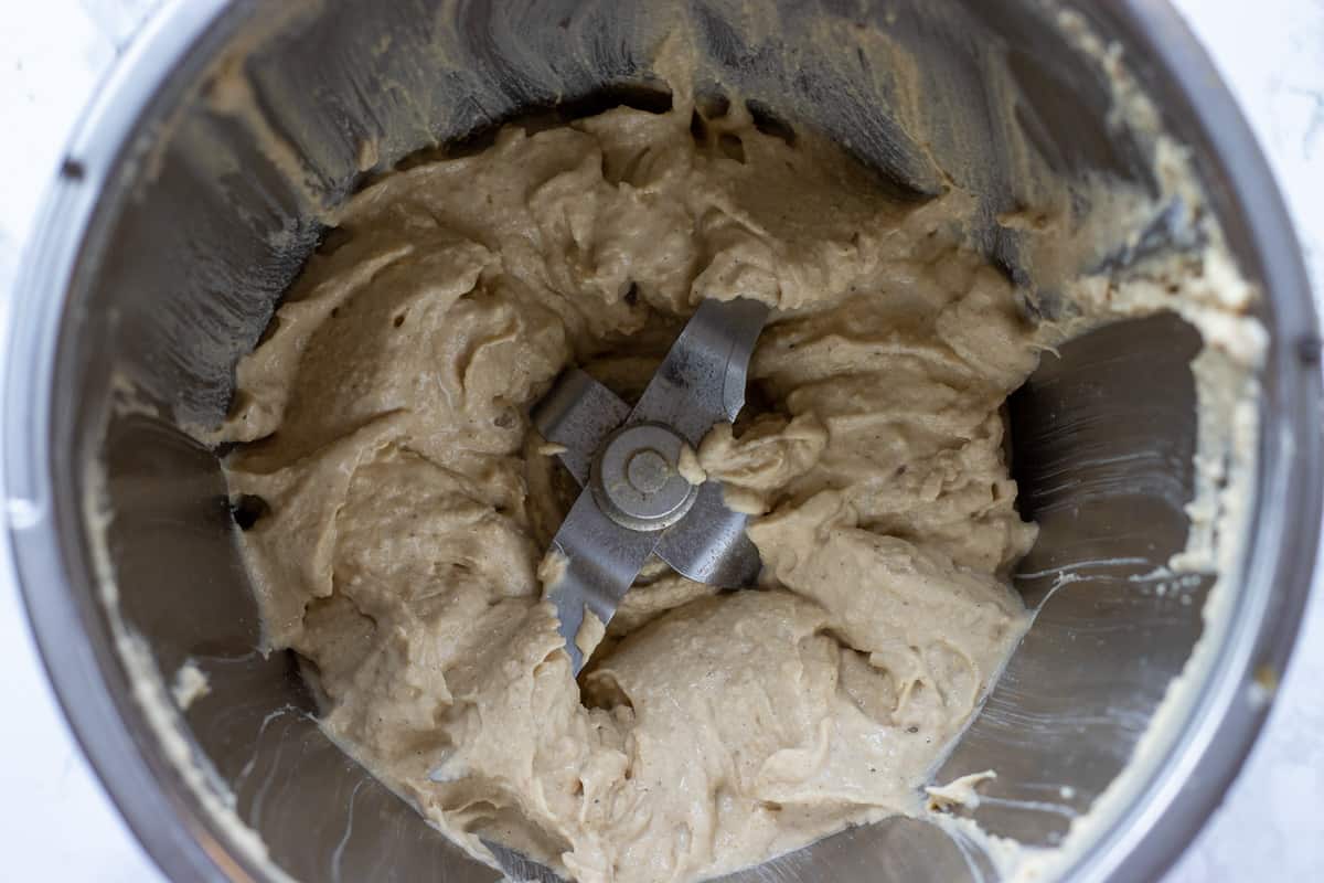 the chickpeas, tahini and lemon juice are blitzed until smooth