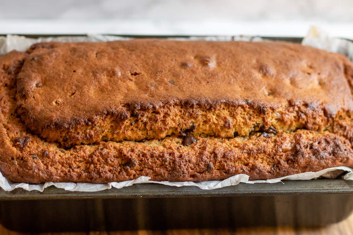 Banana bread with chocolate chips is cooling down before slicing