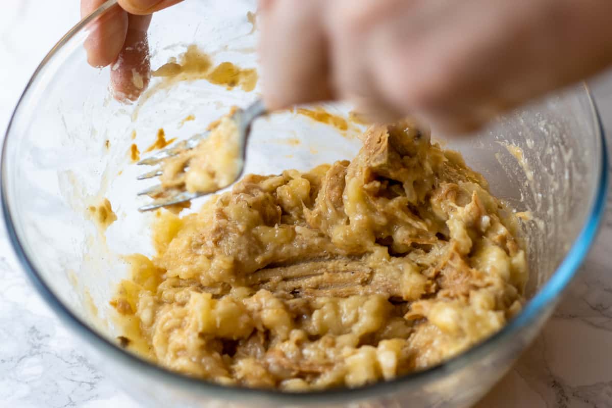 peanut butter is added to smashed bananas