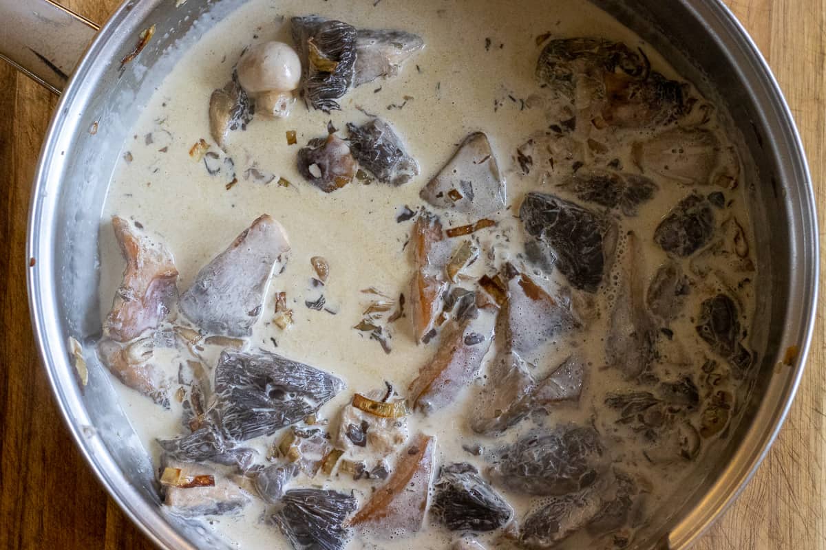 cooking the mushrooms in cream