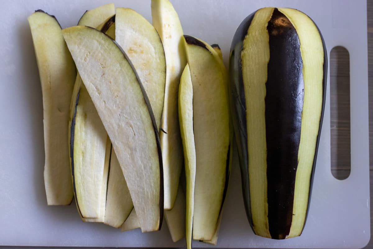 1 peeled aubergine is sliced into strips