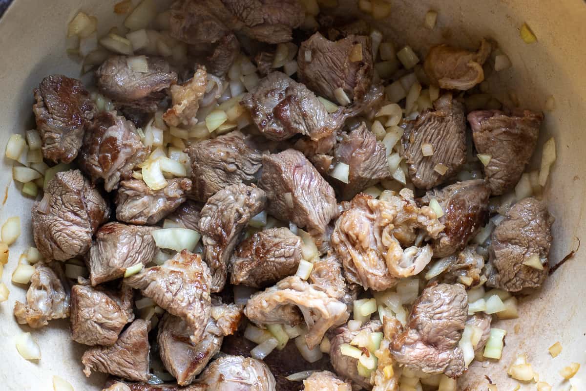 sautéing the onions with beef