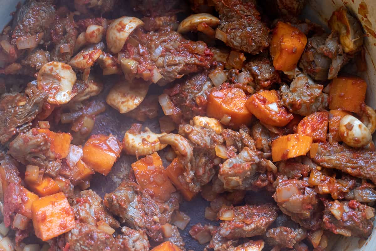 tomato paste is added to the beef