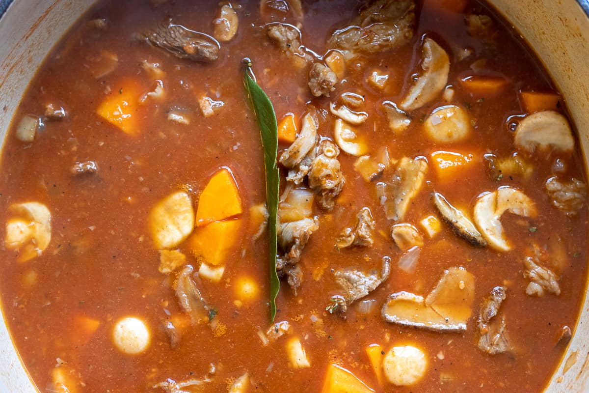 beef stock is added to the pan