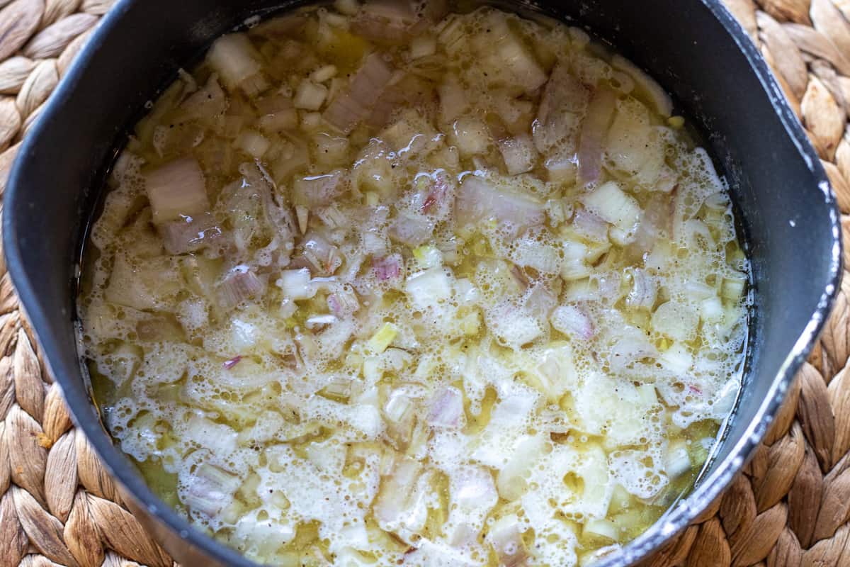 The shallots/red onions are added to the warm sauce