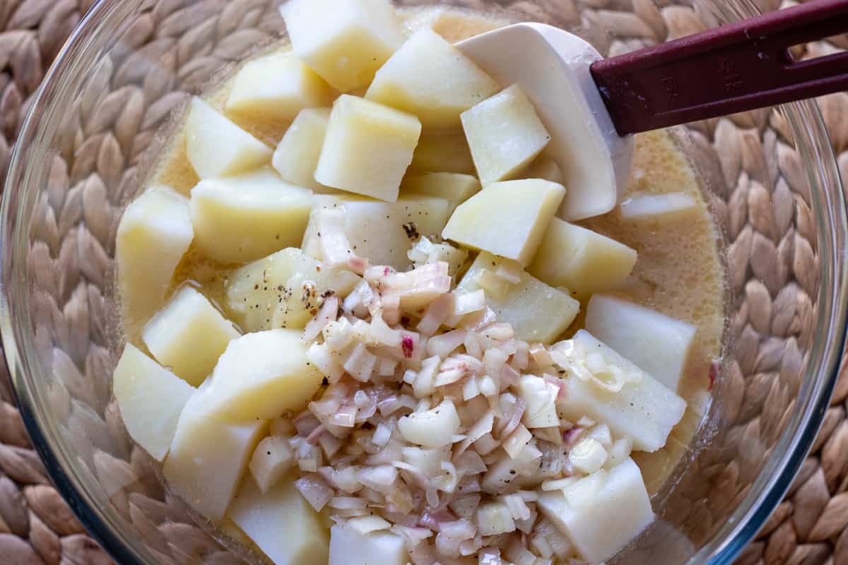 the dressing is combined with the cooked to potatoes