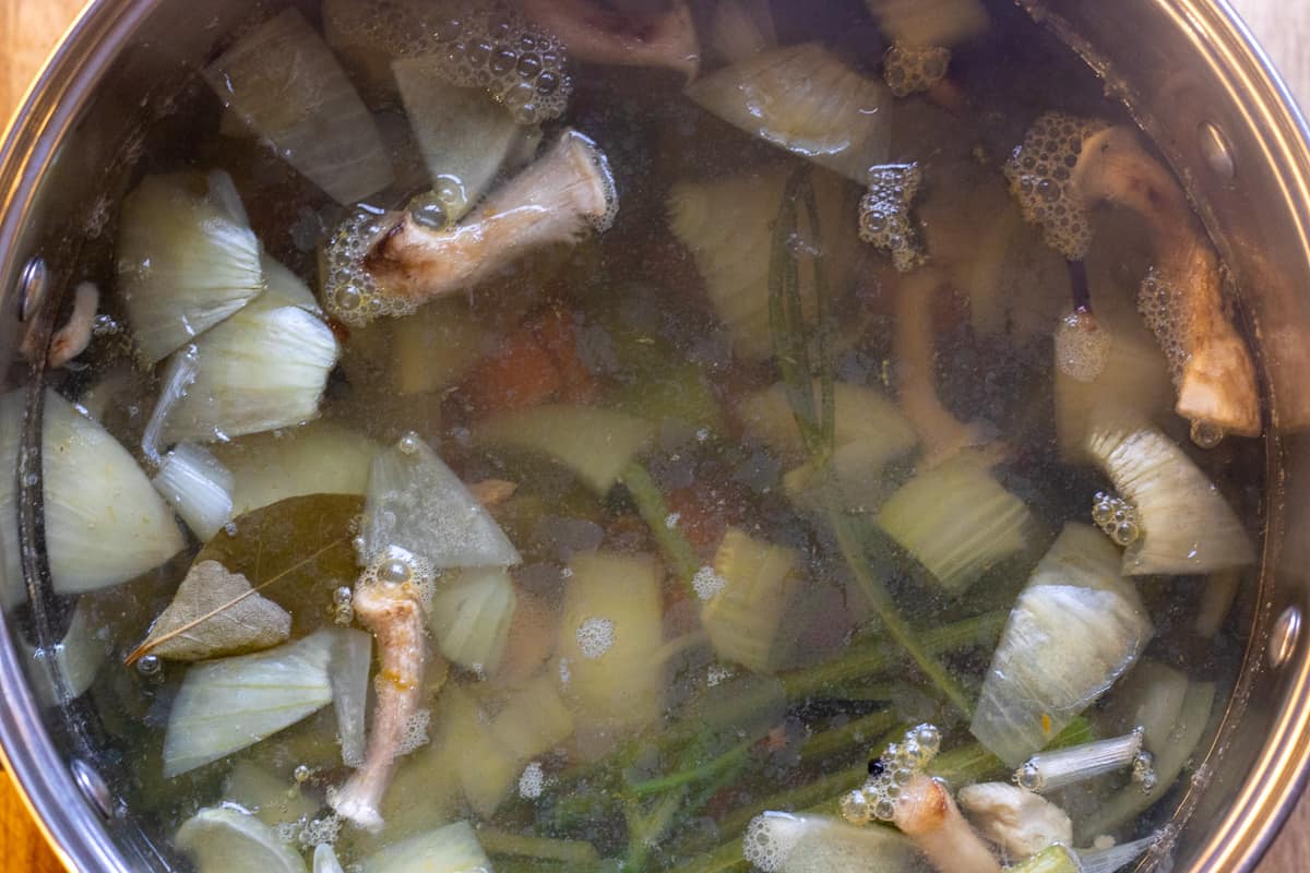 vegetable stock is cooked for an hour