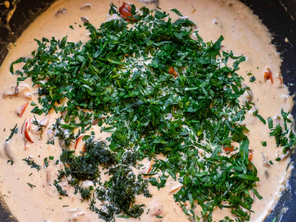 the herbs are added to the sauce