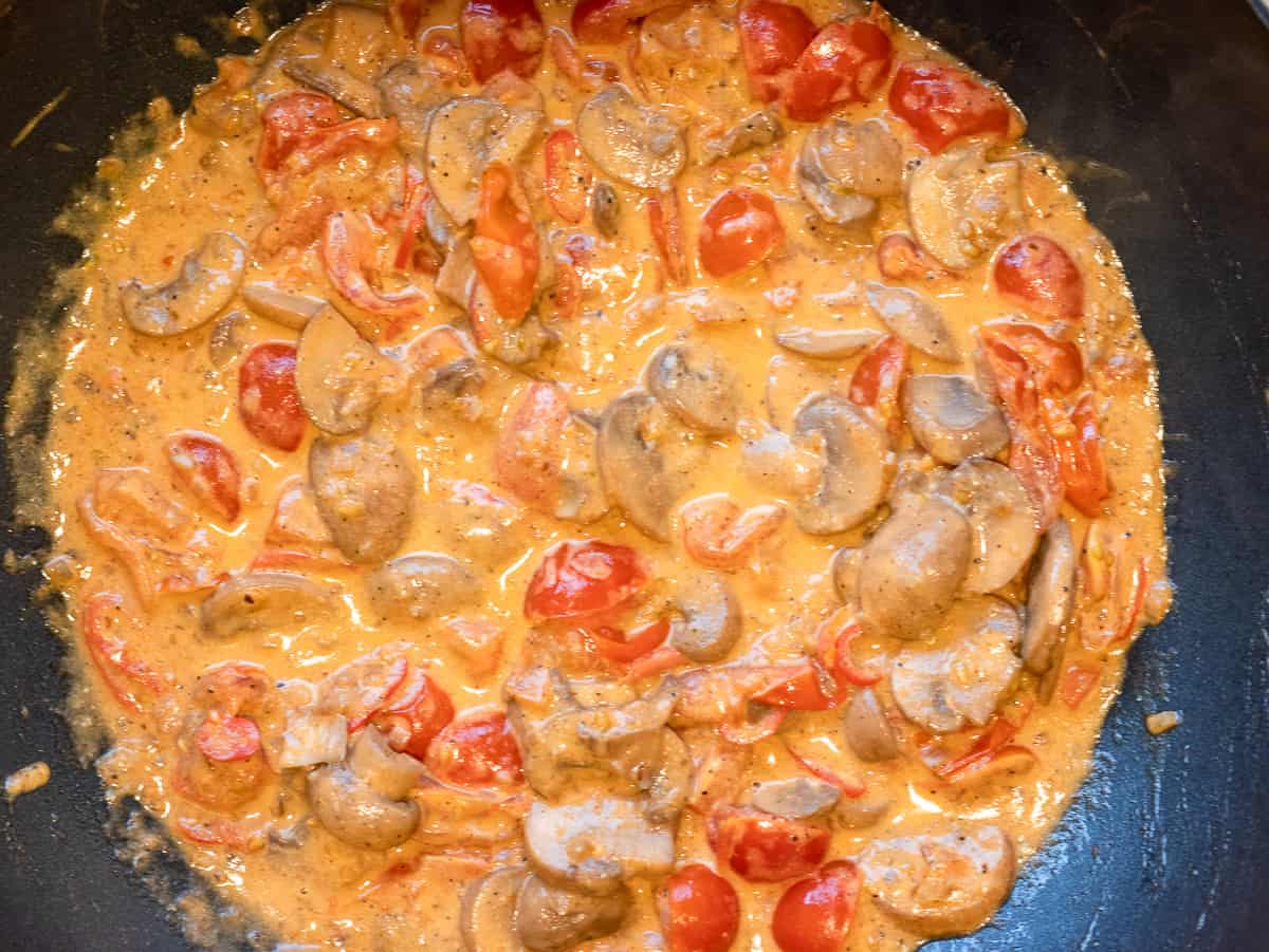 Mascarpone and double cream added to the pan