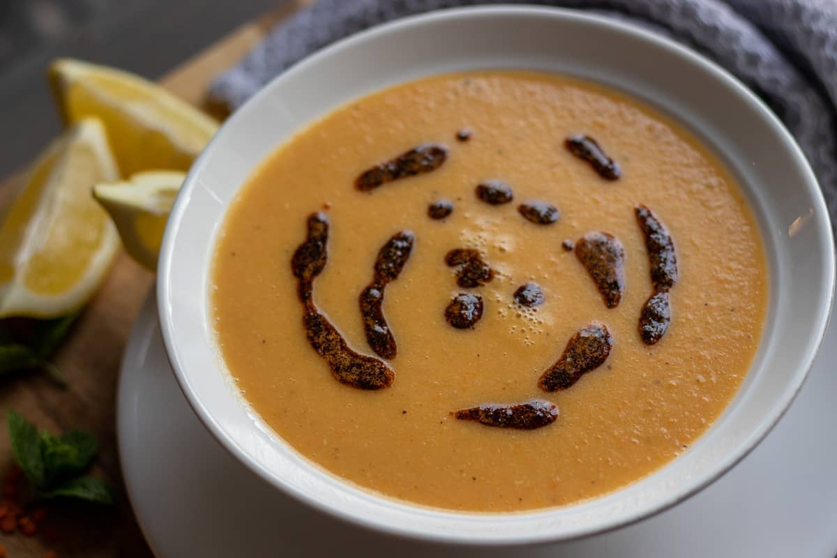 lentil soup - mercimek Corbasi served with lemon wedges
