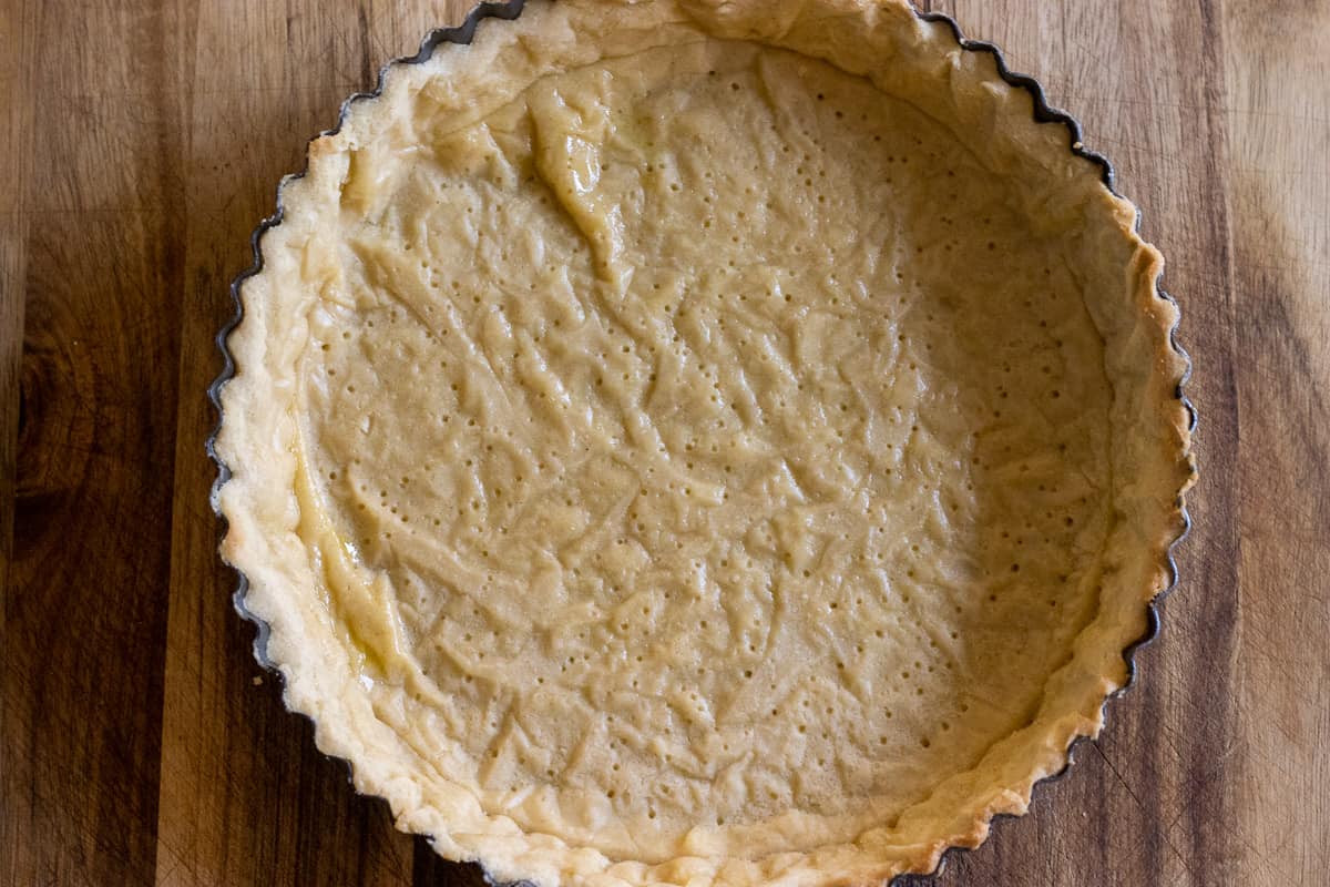 the tart base is baked half way through