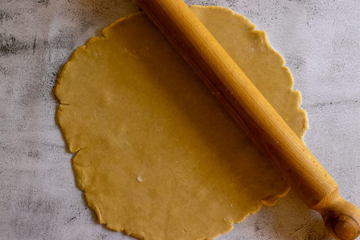 rolling the pate a sucre for making Tart aux fraise - French Strawberry Custard Tart
