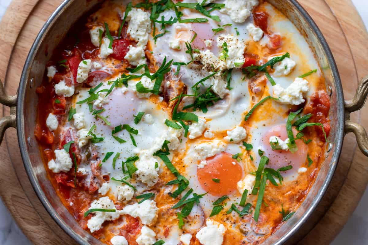 Eggs are gently poached in tomato&pepper sauce