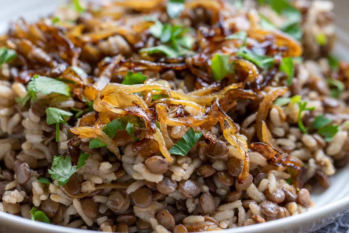 Mujadara is served with caramelised onions and chopped parsley