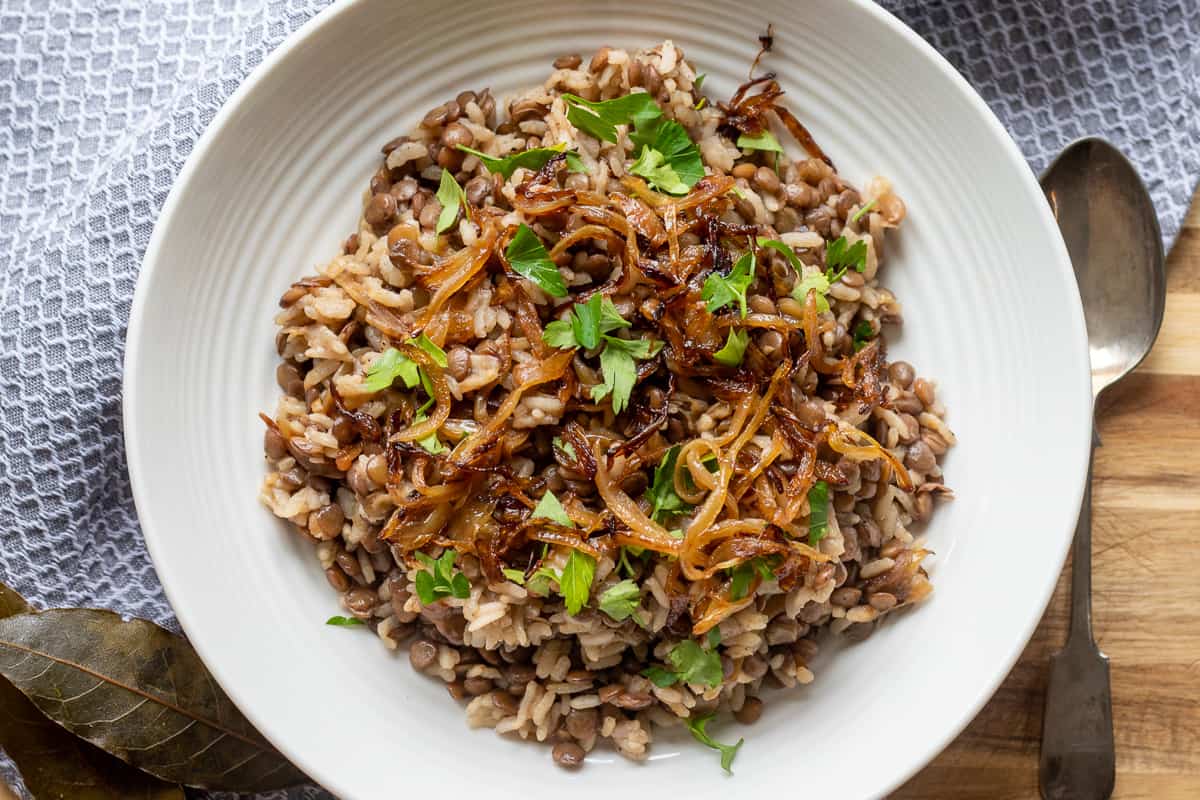 Lebanese lentil and rice dish garnished with chopped parsley