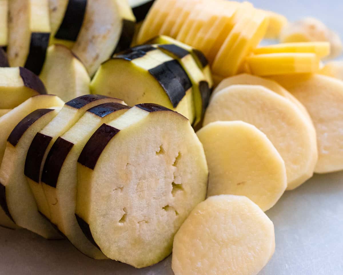 Sliced aubergine and potatoes for moussaka.