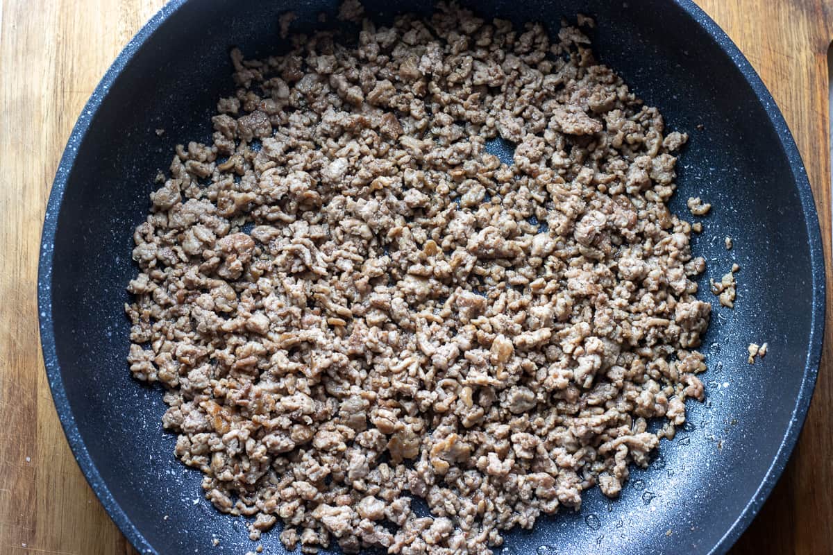 ground lamb is browned in a pan