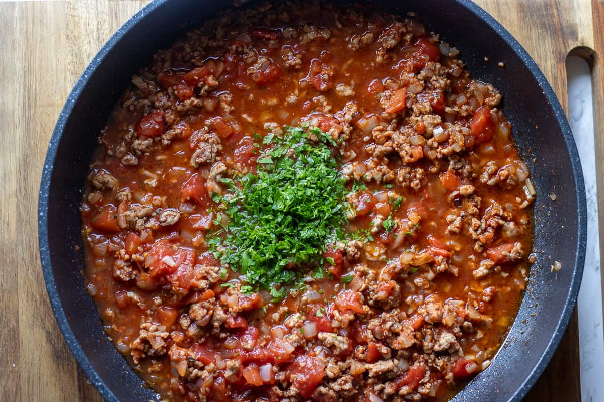 parsley is added to the meat sauce