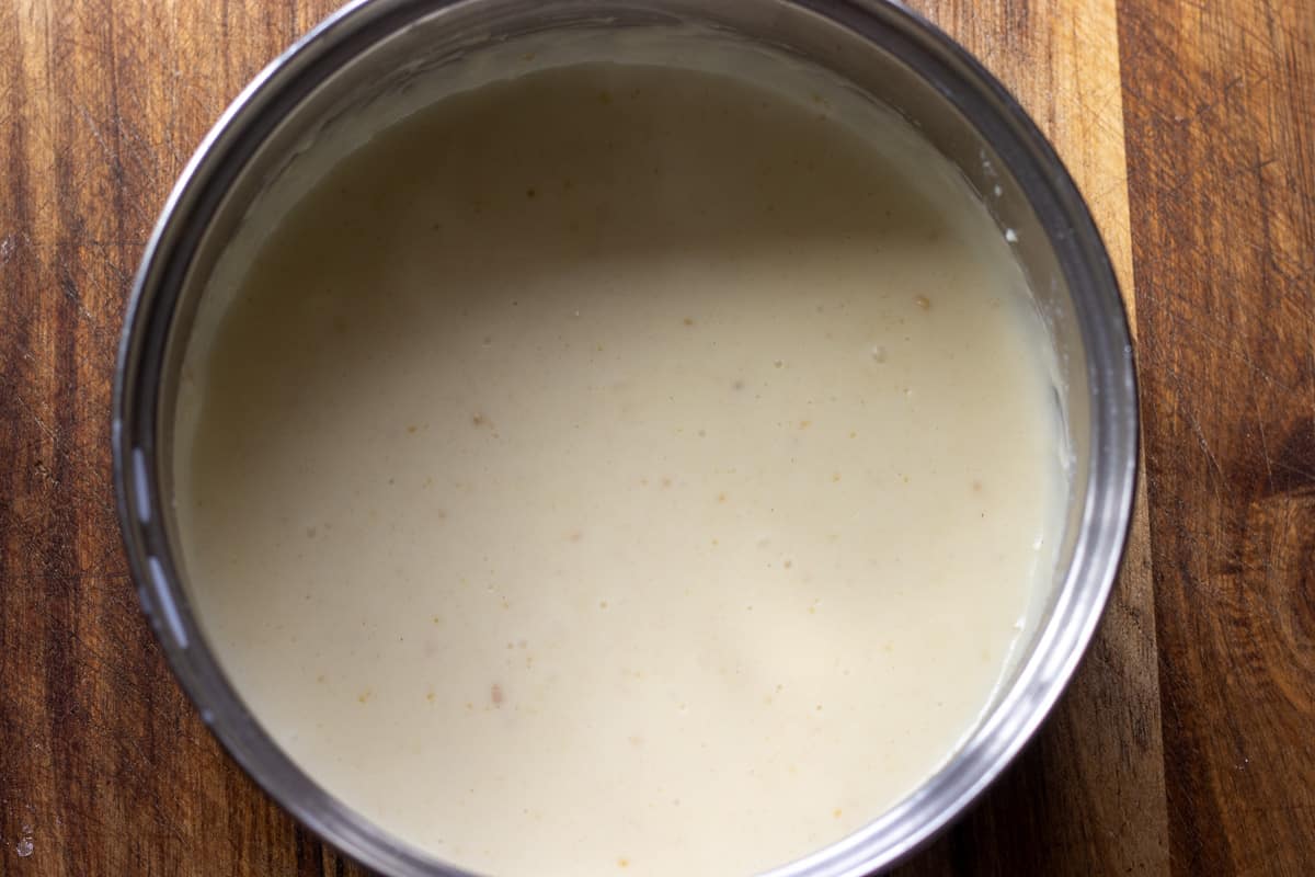 the milk is gradually added to the flour and butter mixture