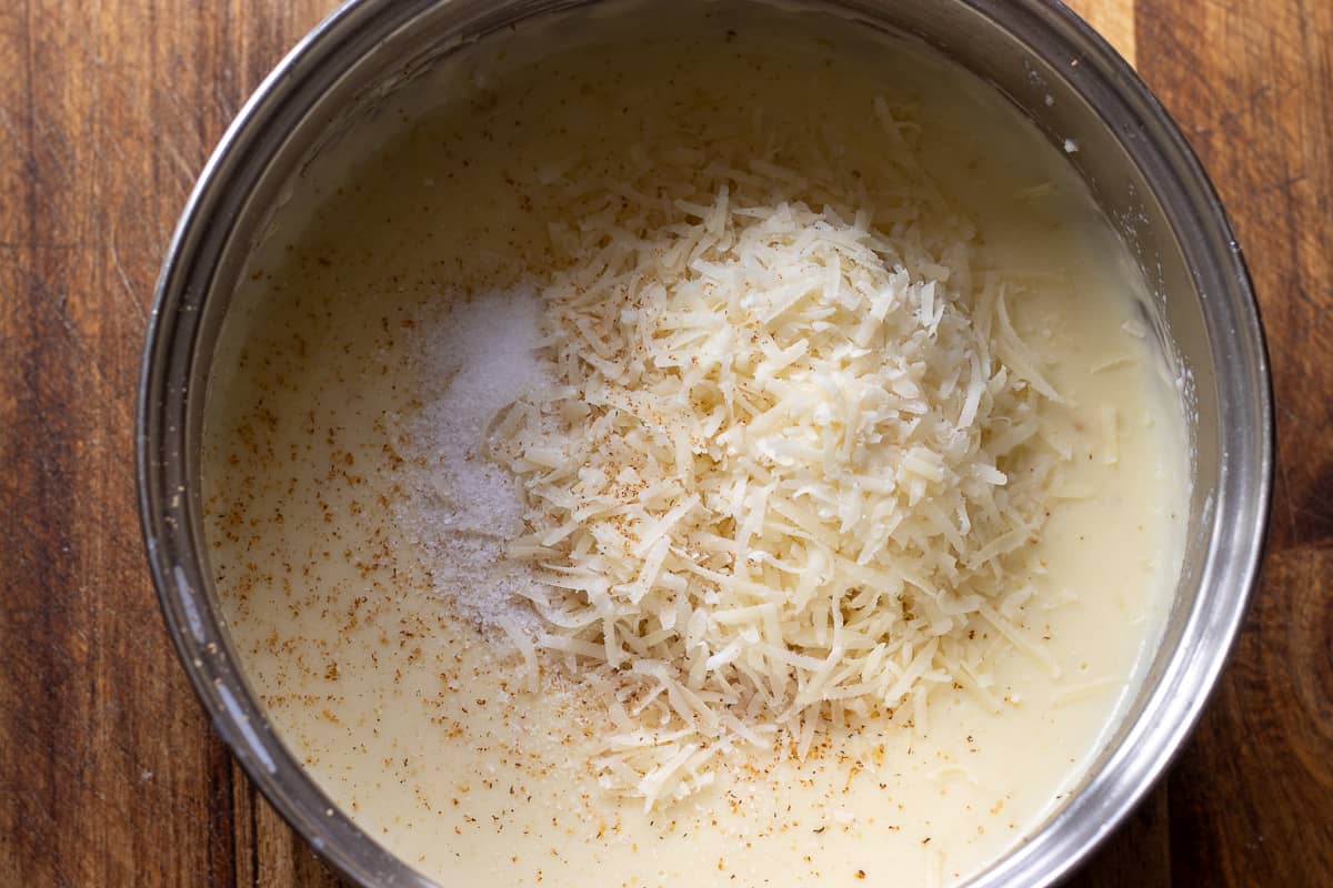 salt, nutmeg, and grated parmesan are added to béchamel sauce