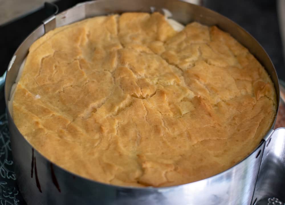 the second large choux pastry is placed on diplomat cream
