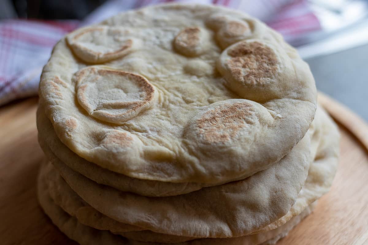 5 pieces of greek pita bread placed on top of each other