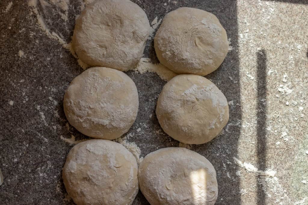 The dough is divided into 6 equal balls.