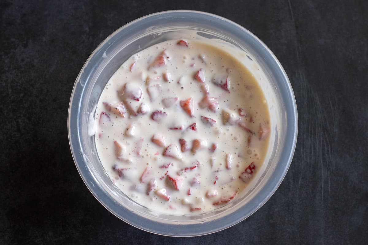 the strawberries are added to cream cheese and egg mixture