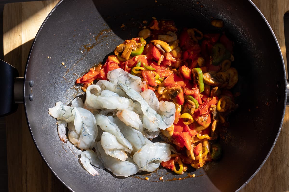 shrimps are added to tomato sauce