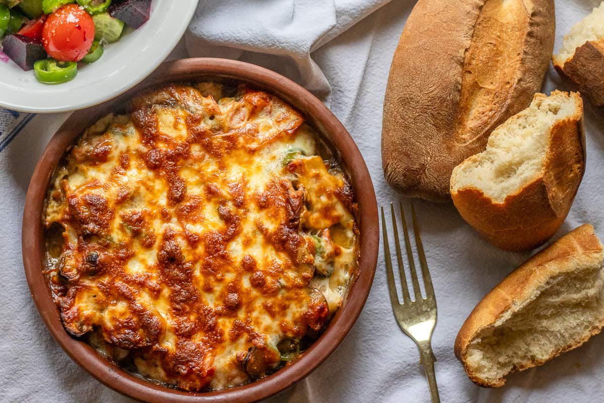 baked shrimp served with salad and crusty bread