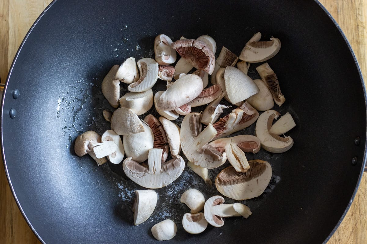 Sautéing the mushrooms with butter