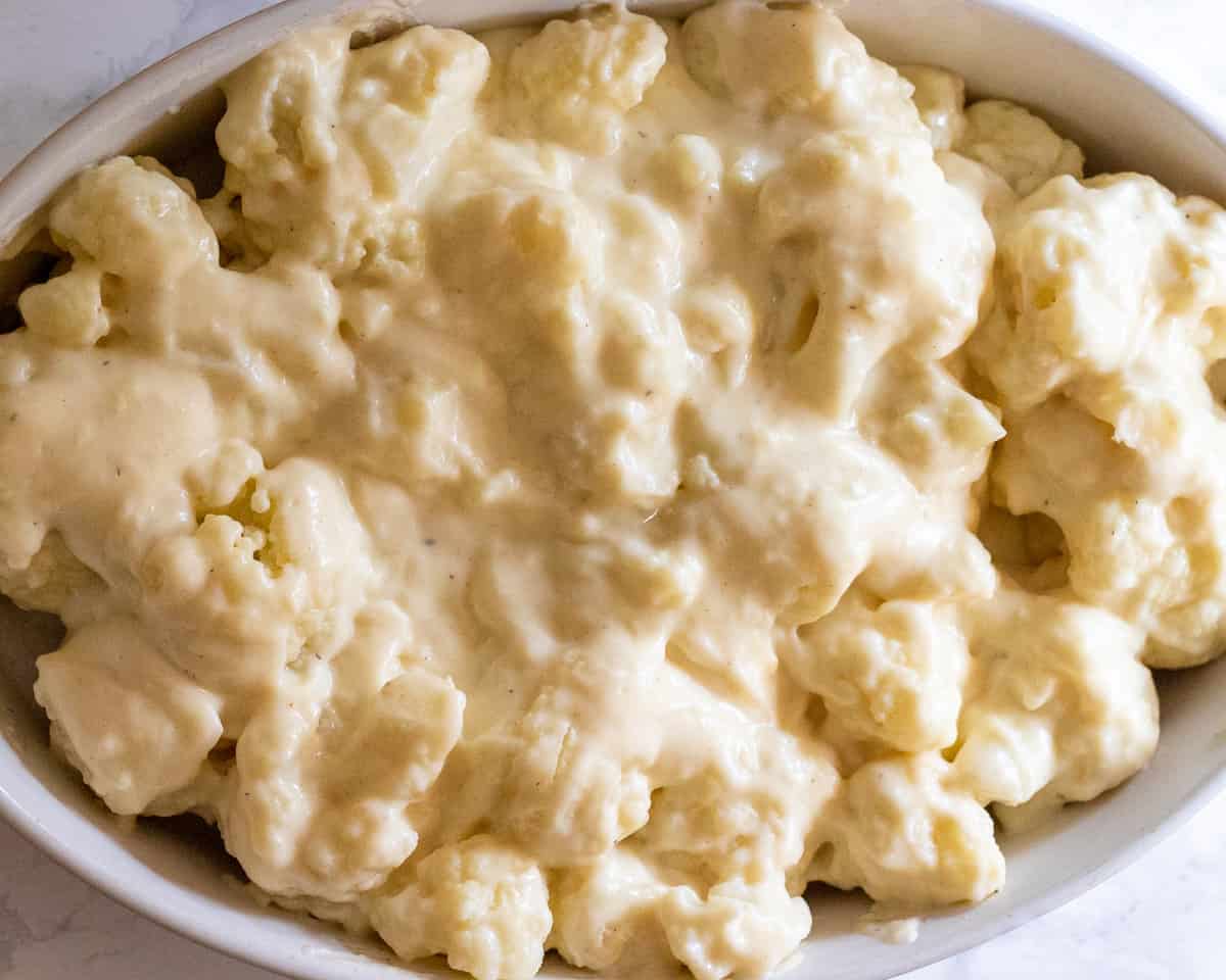 Cauliflower fleurets cowered with cheese sauce