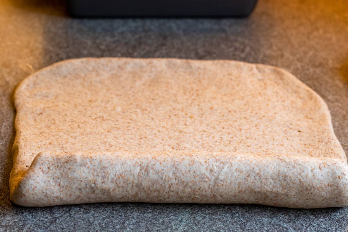 rolling the dough into a log shape