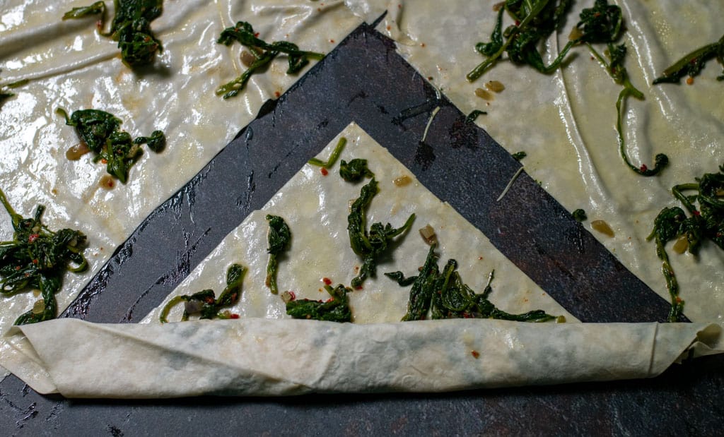 The yufka is cut in 4 equal pieces