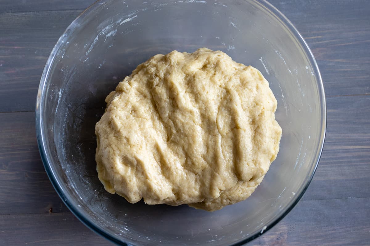the dough for minced beef pie is in a bowl