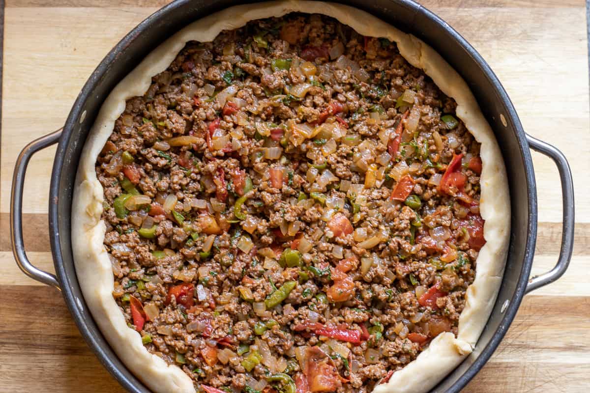 the sides of the pastry are folded on top of the filling