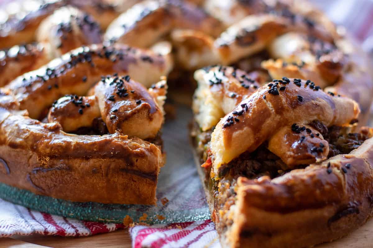 a slice of freshly made minced beef pie