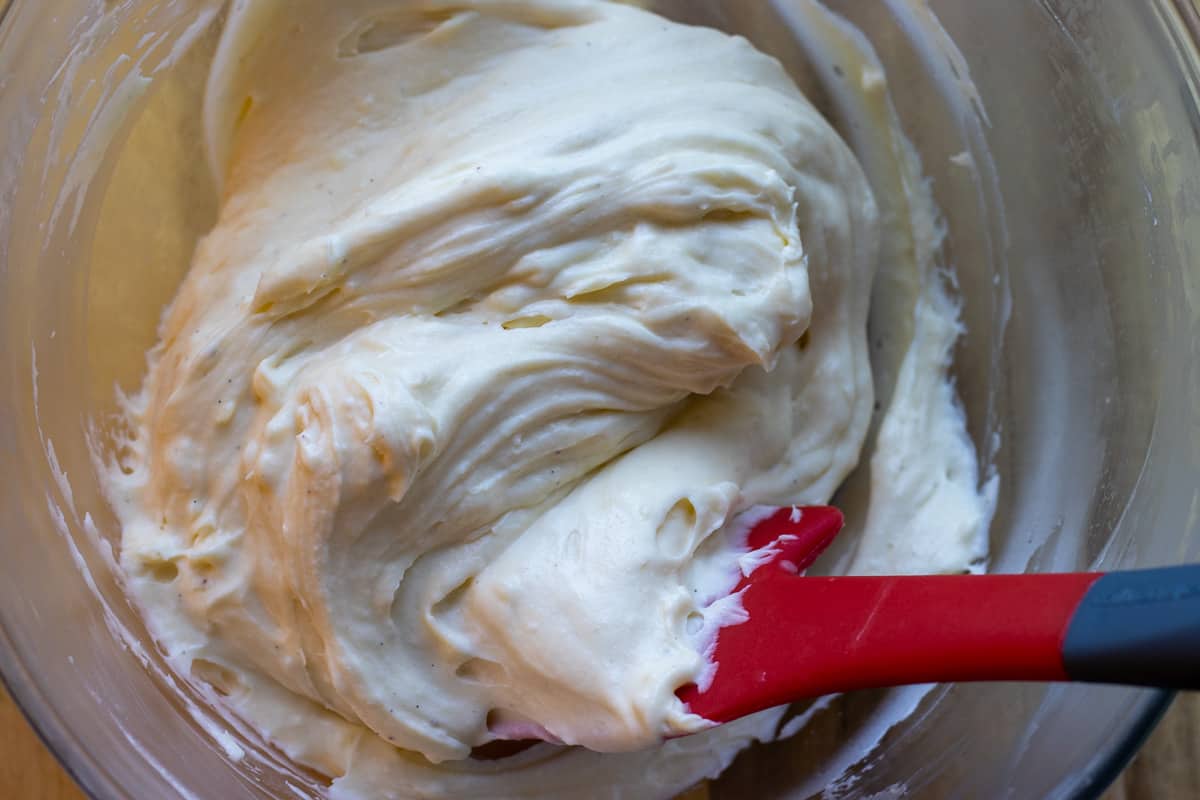 adding the whipped cream to cooled creme patisserie