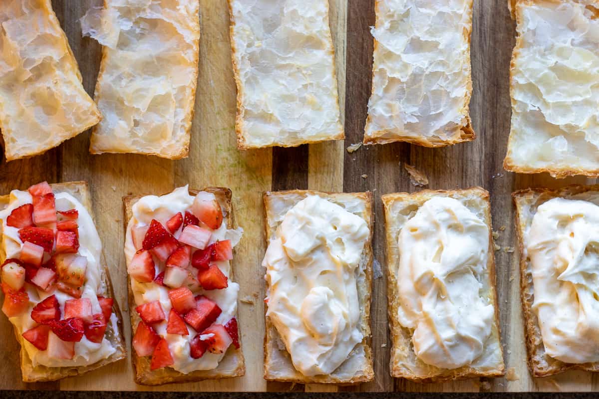 put some diplomat creme on a piece of the pastry and add chopped strawberries on top